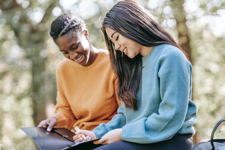 Two friends discussing what looks good on a college application